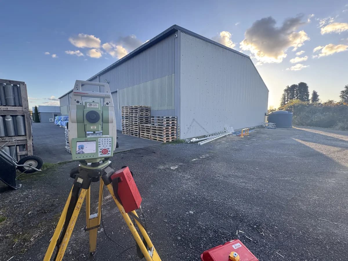 Foresight Surveying total station set up on site at dusk